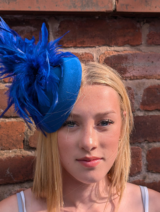 Royal blue pill box with feather accents fascinator