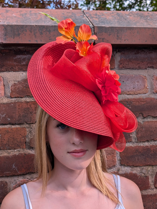Coral assymetric rouge fascinator