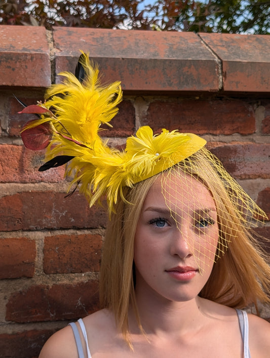 Yellow feathered hat