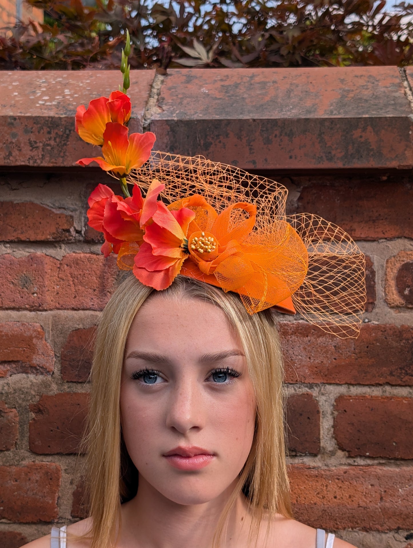 Orange flowery fascinator