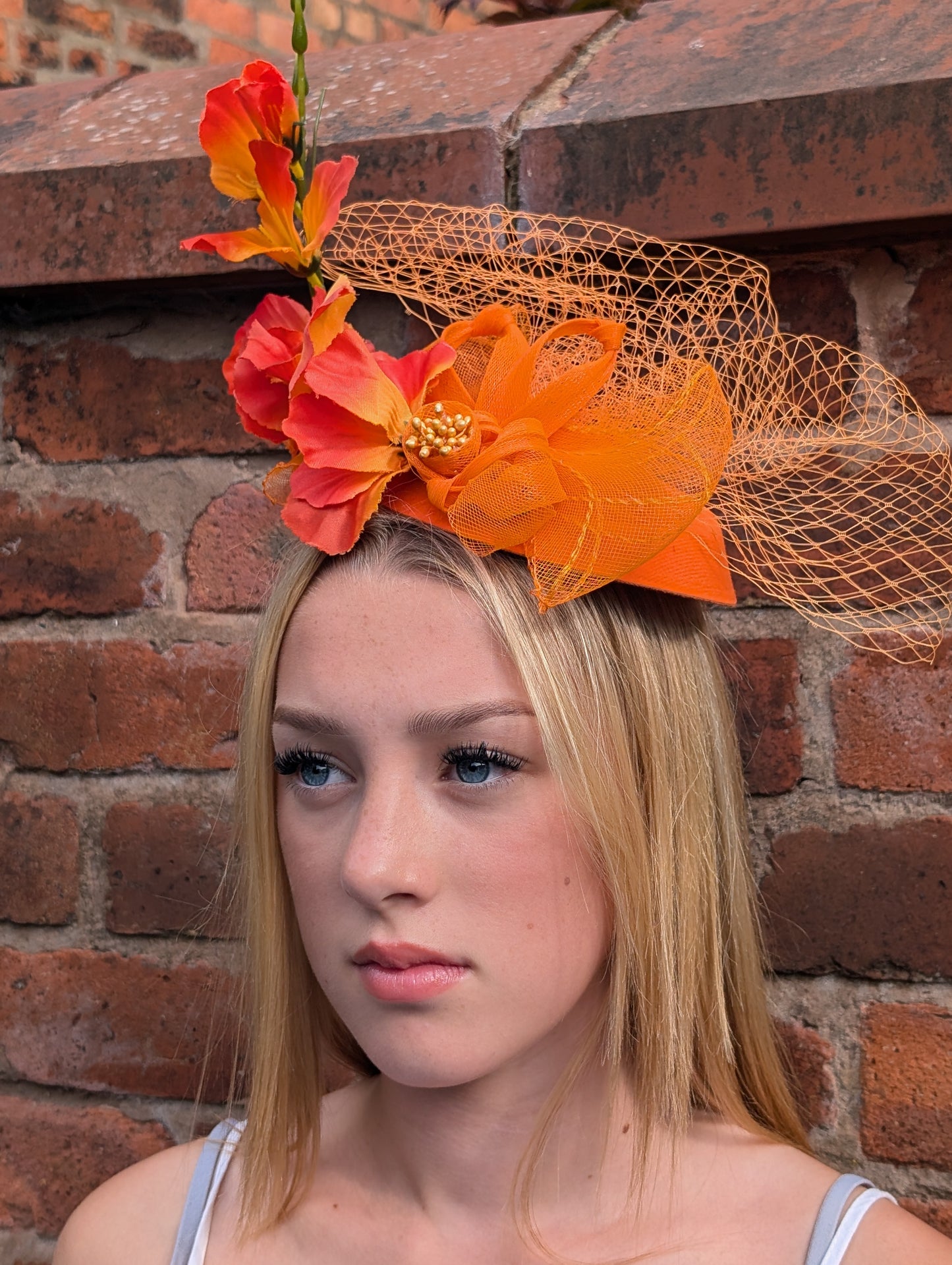 Orange flowery fascinator