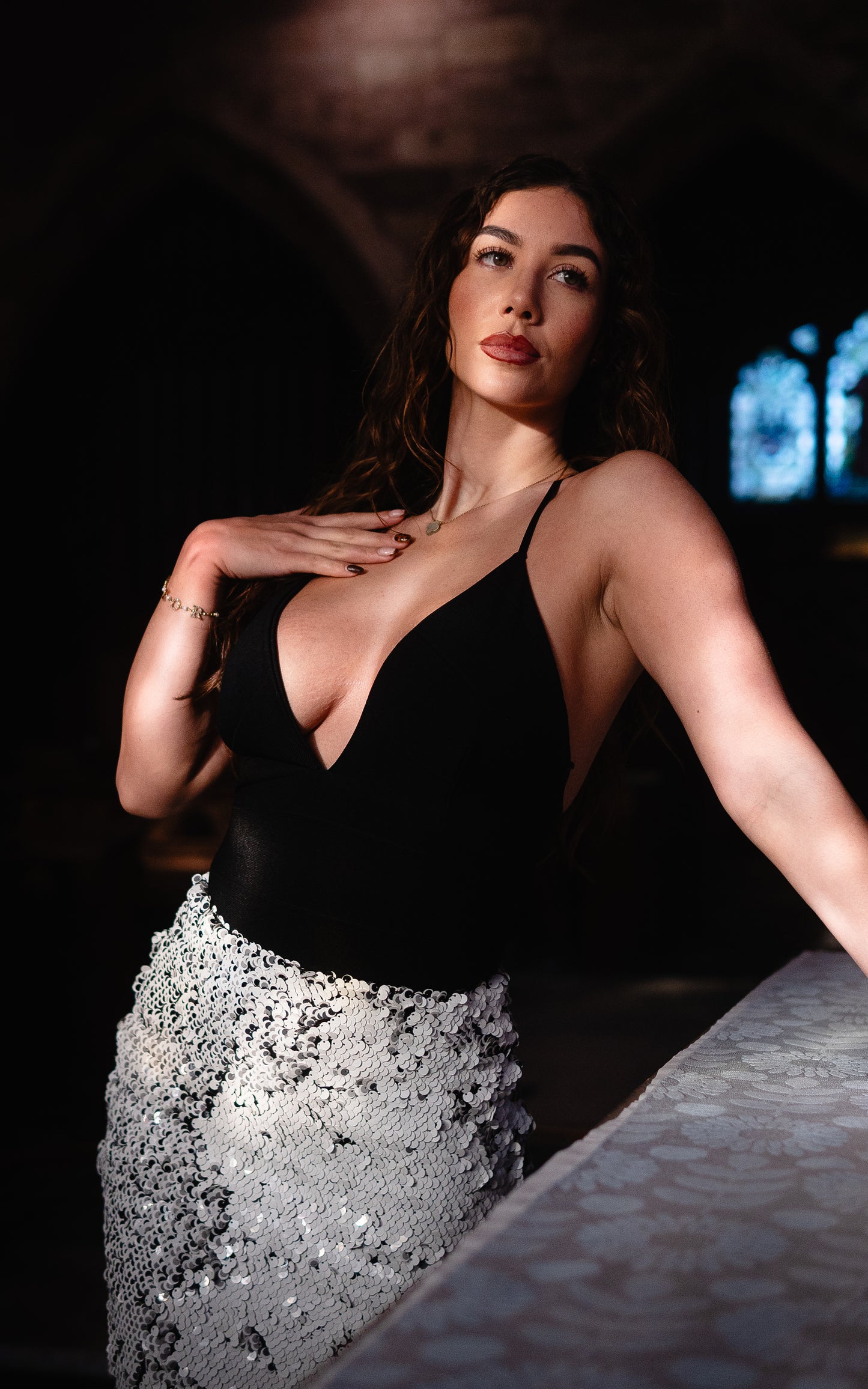 Two in one black and white sequin  ensemble with black strap bodycon top that can be worn as a mini dress