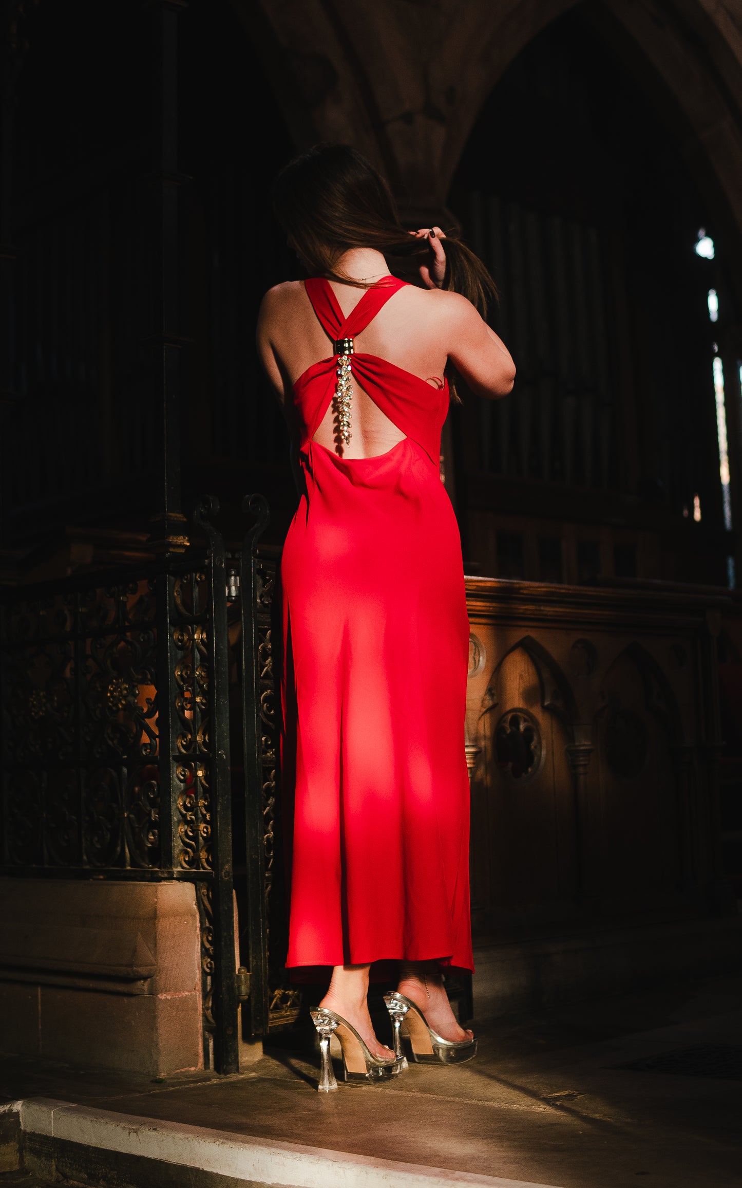 The Serena dress; gorgeous red plunge neck and cross back midi dress and strikingly beautiful gold ornament at the back .