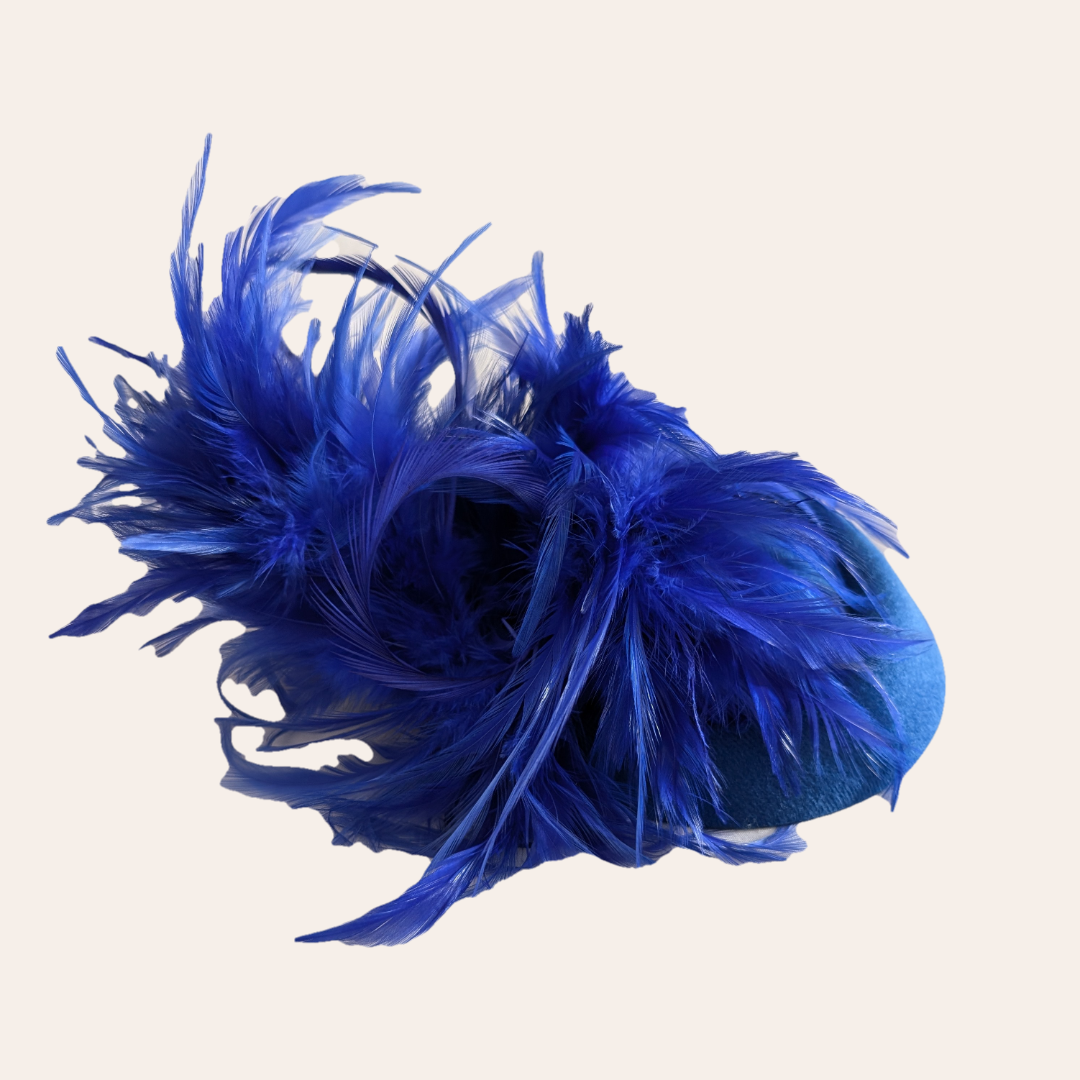 Royal blue pill box with feather accents fascinator